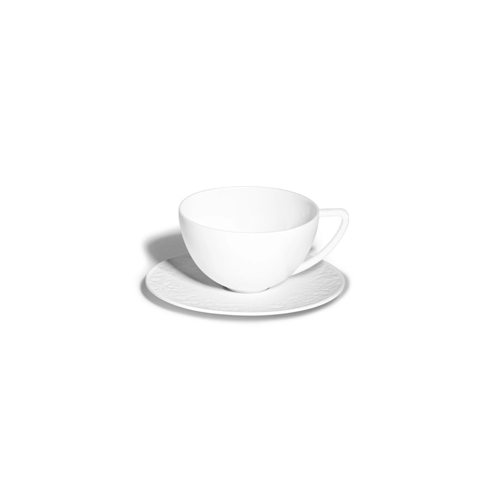 Porcelain tea cup and saucer from the Soil is Our Soul collection, combining decorative style with french artisans tradition.
